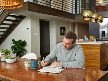 Man at desk working on financing